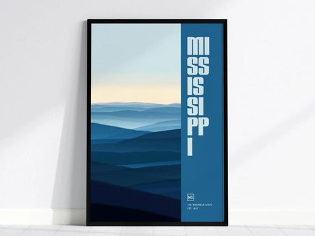Framed poster featuring layered blue hills and bold vertical text reading Mississippi in white. The design includes subtle gradients, creating a serene and minimalist aesthetic.
