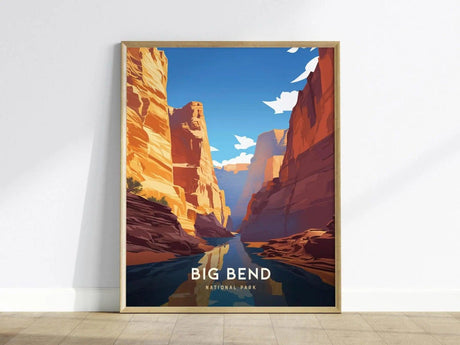 Framed poster of Big Bend National Park depicting vibrant desert canyons and a river under a clear blue sky, leaning against a white wall.