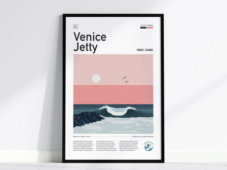 Framed poster featuring a minimalist design of Venice Jetty, with a pastel pink sunset, gentle waves, and birds flying overhead. Text overlays provide additional information about Venice, Florida.