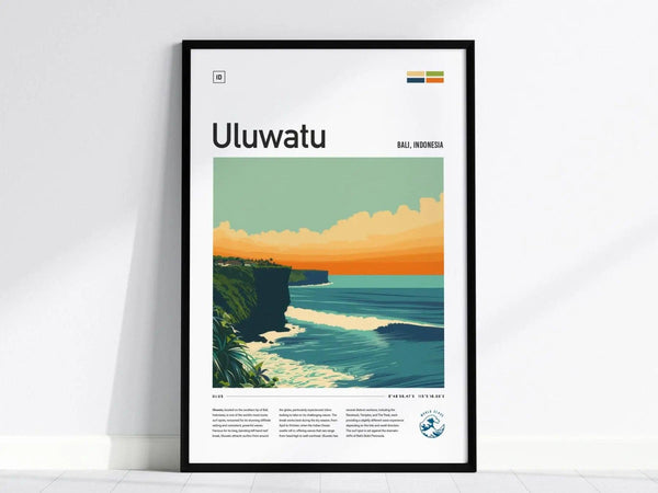 Framed poster titled Uluwatu features a colorful illustration of Balis coastline with dramatic cliffs, turquoise waves, and an orange sunset sky. Text and a logo appear below the image.