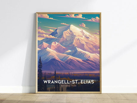 A framed poster of Wrangell-St. Elias National Park depicts dramatic mountain peaks under a vibrant sky with soft clouds, capturing the rugged beauty of Alaskas wilderness.