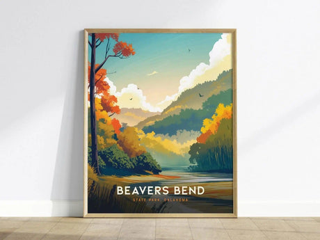 Framed poster depicting a colorful landscape of Beavers Bend State Park, featuring vibrant autumn trees, a winding river, and distant hills under a bright sky.