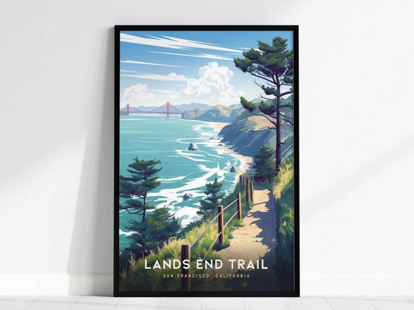 A framed poster depicting a coastal trail with ocean cliffs, cypress trees, and the Golden Gate Bridge in the distance under a blue sky.