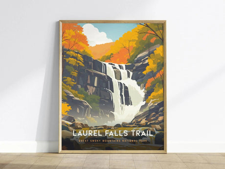 A framed poster of Laurel Falls Trail depicts a cascading waterfall surrounded by vibrant autumn foliage. The text reads Laurel Falls Trail, Great Smoky Mountains National Park.