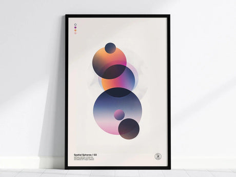 A framed poster features abstract geometric spheres overlapping with gradient transitions in vibrant hues on a light background. The minimalist design is titled Spatial Spheres / 03.