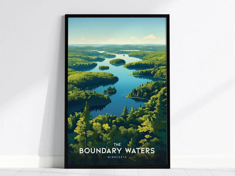Framed poster of Boundary Waters, Minnesota, depicting a serene lake winding through lush green forests under a clear blue sky. The text The Boundary Waters Minnesota is at the bottom.