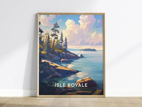 Framed poster of Isle Royale National Park featuring a serene landscape with rocky shorelines, tall trees, and a tranquil lake under a vibrant sky, leaning against a white wall.