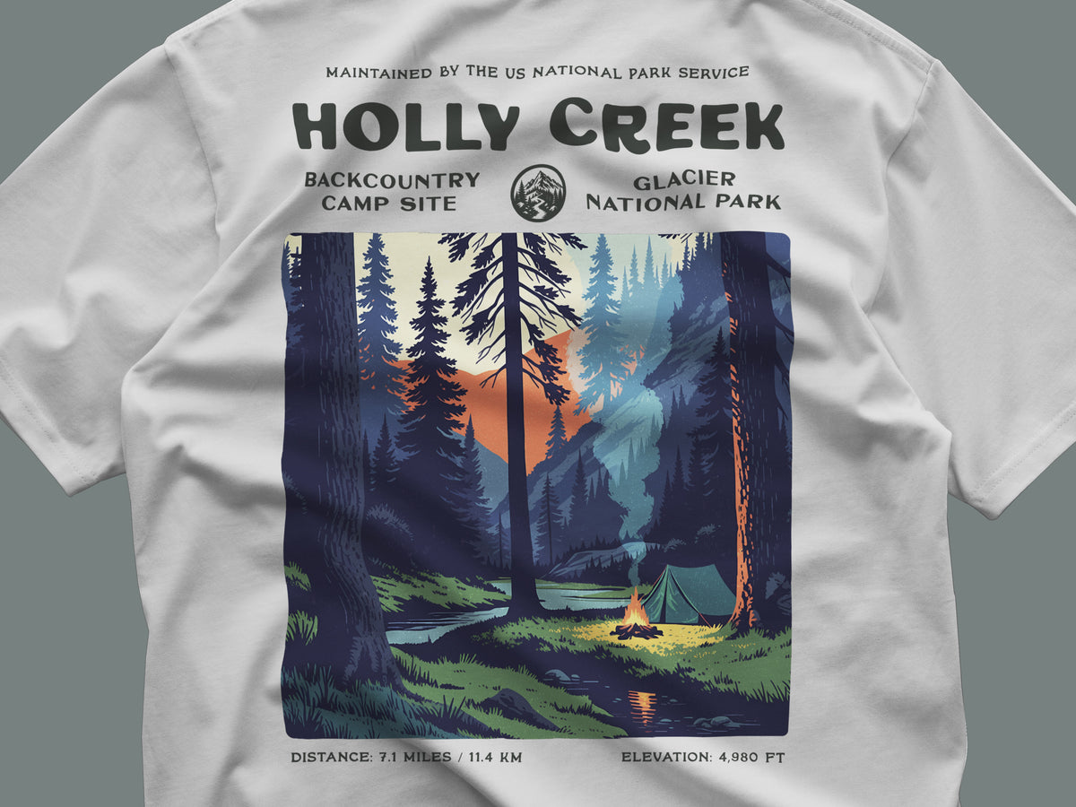 Holly Creek Backcountry Site Hiking T-Shirt | Camper Gift | Glacier Wilderness Trail Tee — close-up of the left-chest pocket