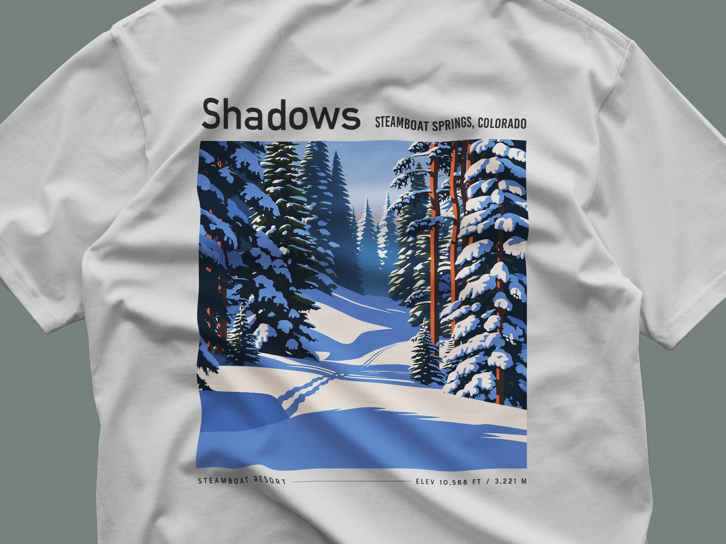 Shadows, Steamboat Ski T-Shirt | Rocky Mountain Powder Art Tee — close-up of the left-chest pocket print