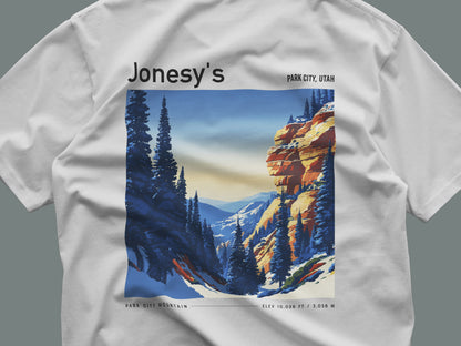 Jonesy's Park City Ski T-Shirt | Utah Mountain Run Art Tee — close-up of the left-chest pocket print