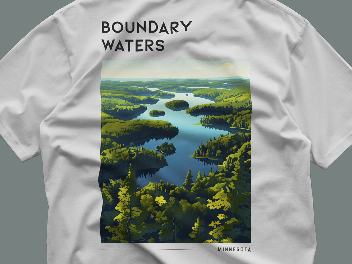 Boundary Waters Travel T-Shirt | Minnesota Wilderness Canoe Country Art — close-up of the left-chest pocket print