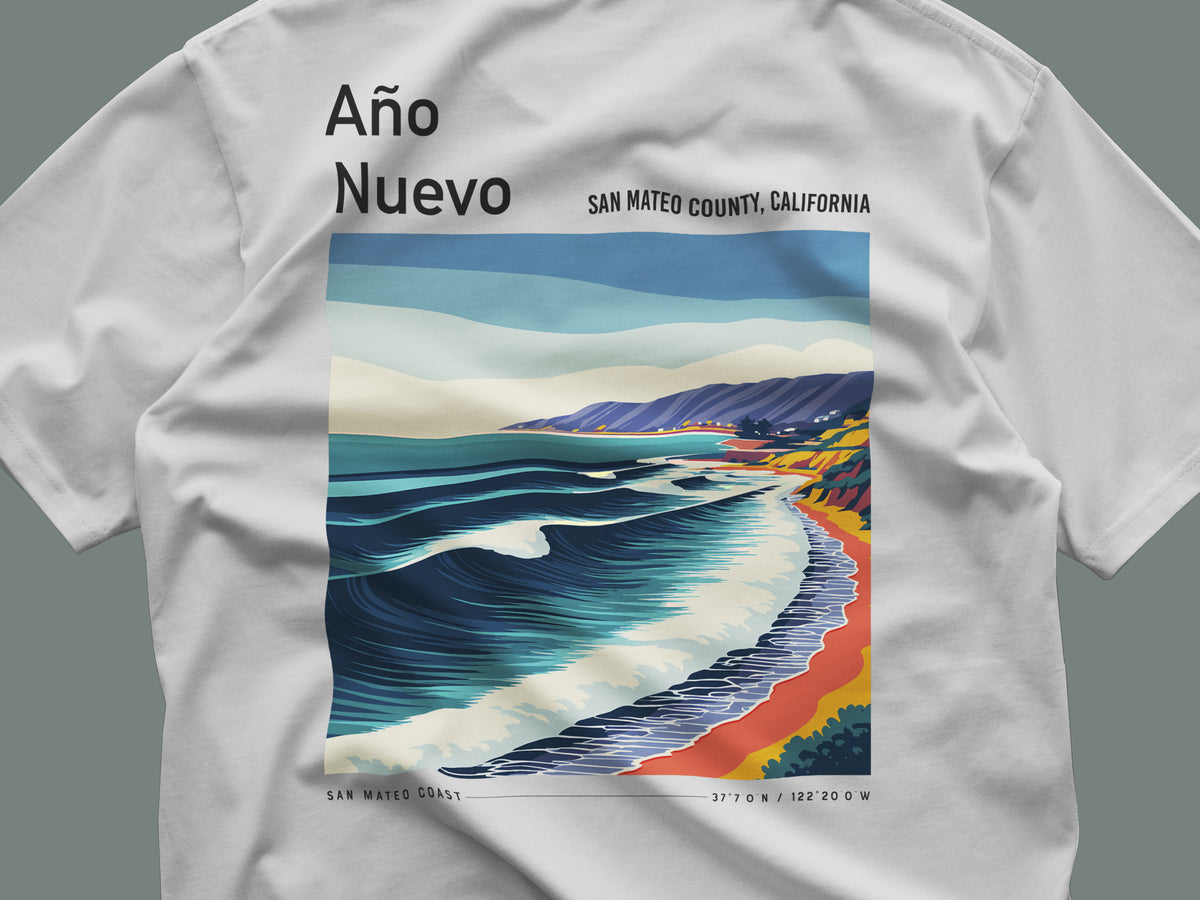 Año Nuevo Surf T-Shirt | Wild Coast Wave Art Tee — close-up of the left-chest pocket print