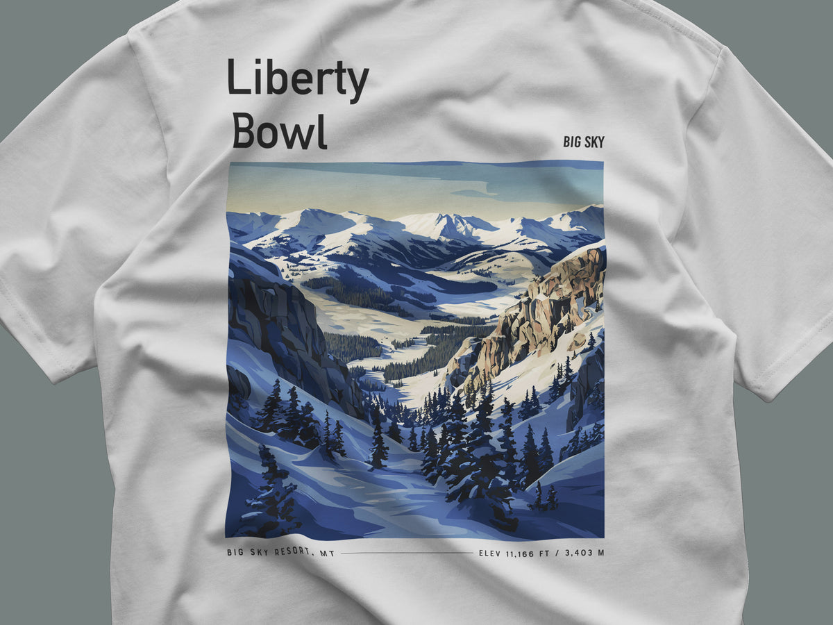 Liberty Bowl Ski T-Shirt | Big Sky Mountain Art Tee — close-up of the left-chest pocket print