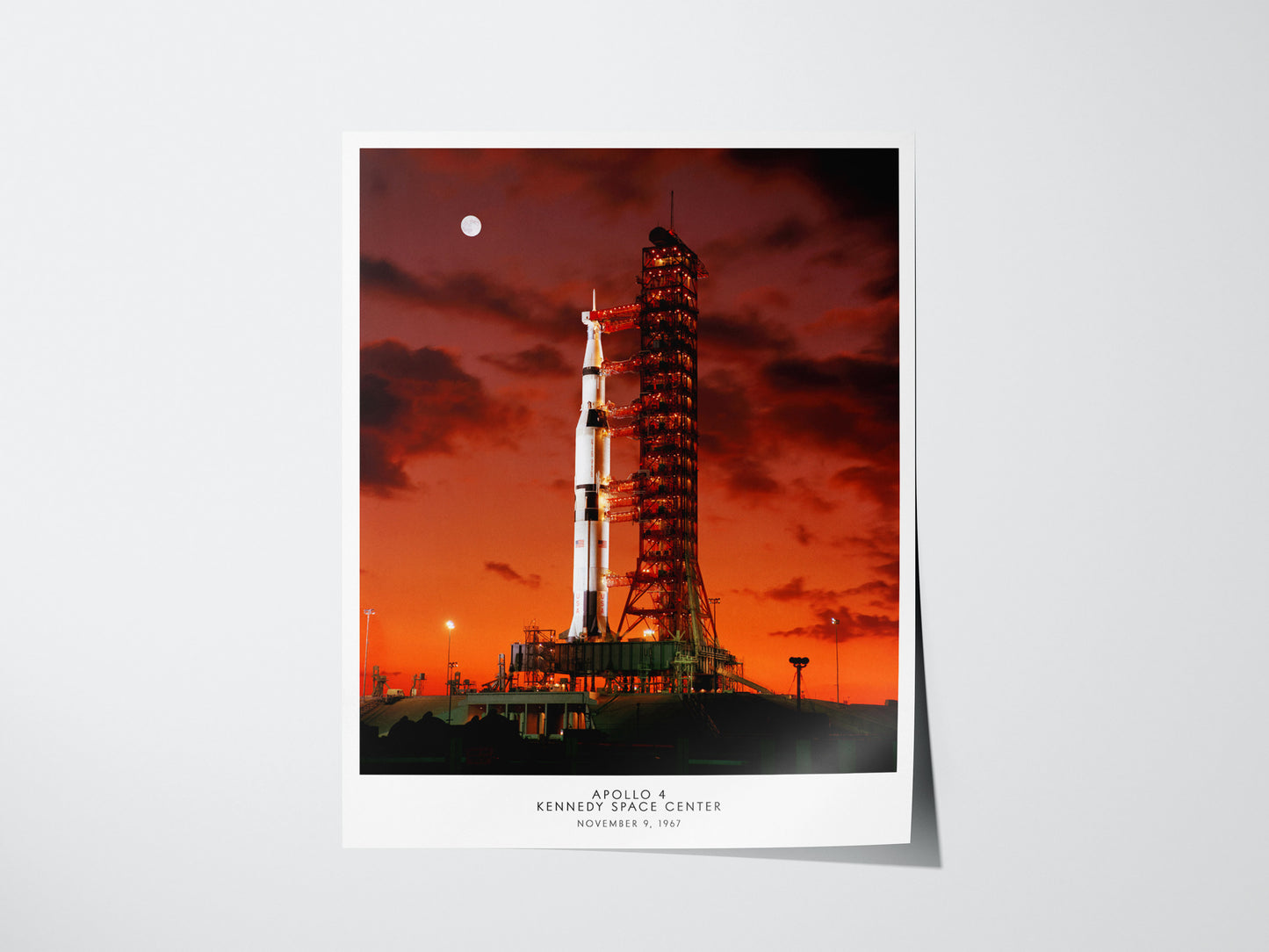 Apollo 4 launch poster featuring Saturn V rocket lifting off from Kennedy Space Center in 1967