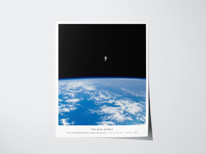 Blue Marble NASA spacewalk poster featuring astronaut floating above Earth in orbit