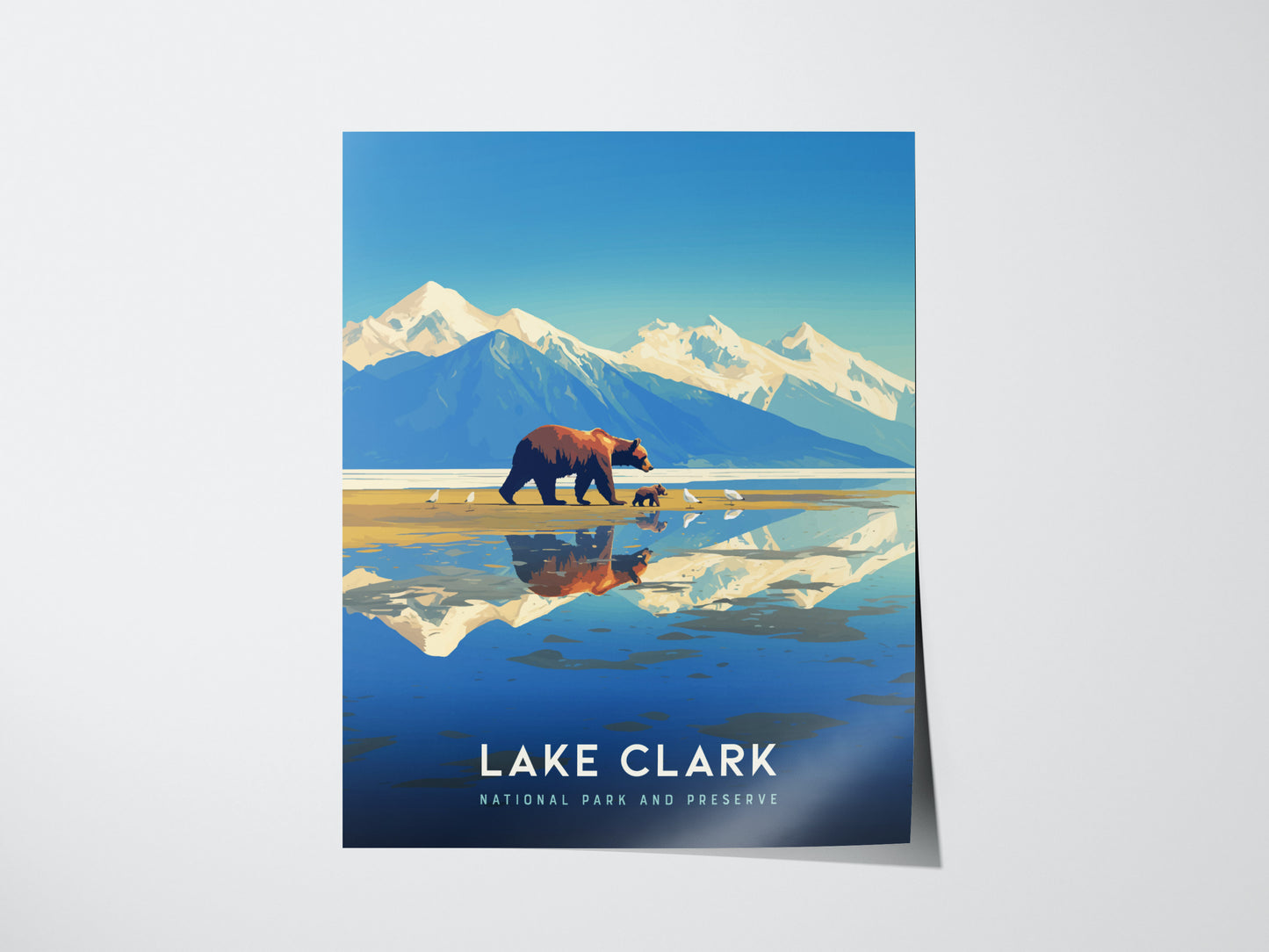 Illustrated poster of Lake Clark National Park features a bear with cubs on a beach, snow-capped mountains, and a reflective lake. Text reads Lake Clark National Park and Preserve.