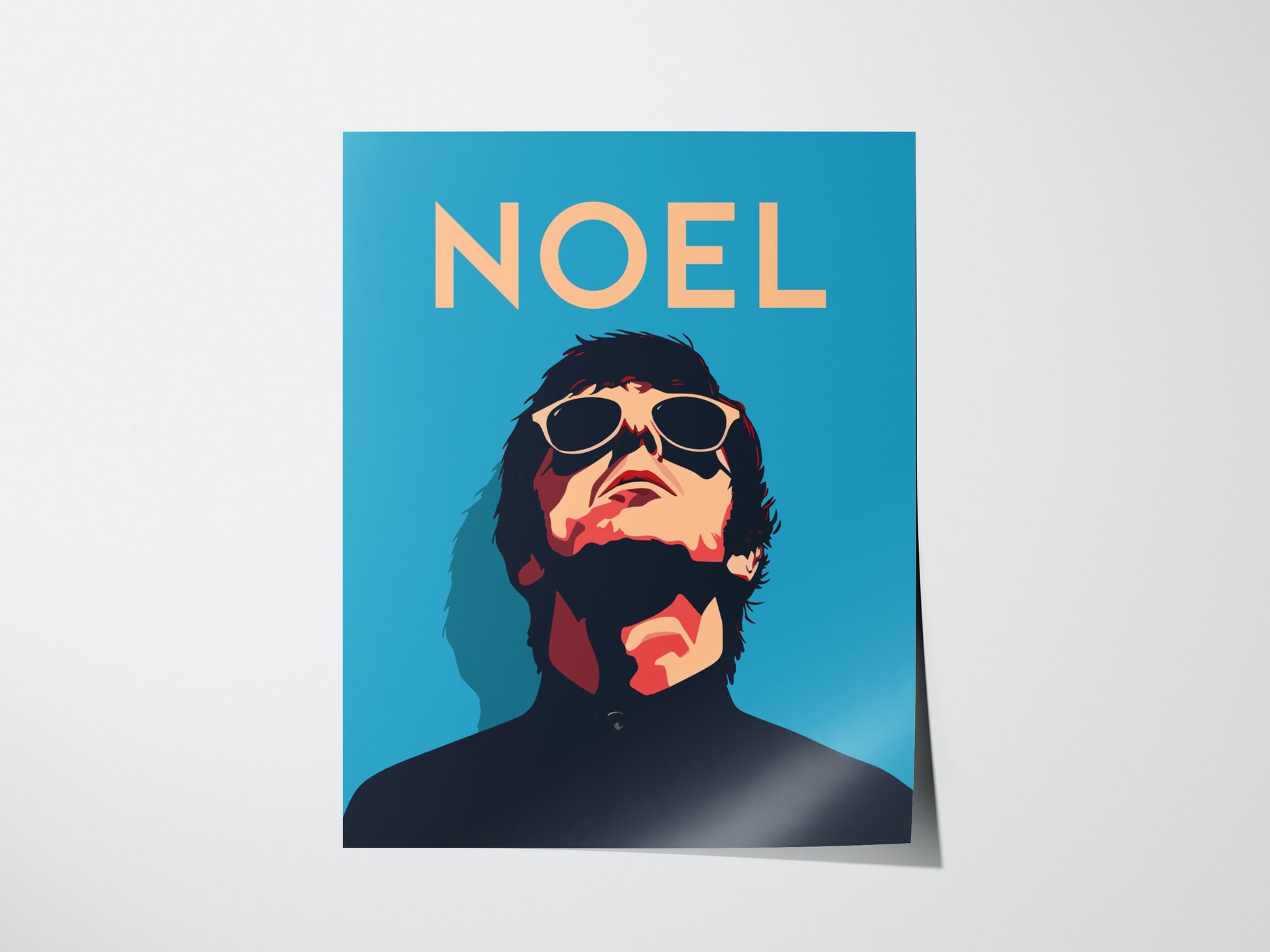 A stylized poster features a person in sunglasses looking upward against a blue background with the name NOEL in bold letters above.