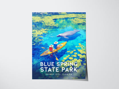 A vibrant poster of Blue Spring State Park shows two kayakers on clear blue water with a manatee, surrounded by yellow lily pads.