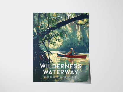 A poster titled Wilderness Waterway depicts a person paddling a canoe through serene water surrounded by dense mangrove foliage in Everglades National Park.