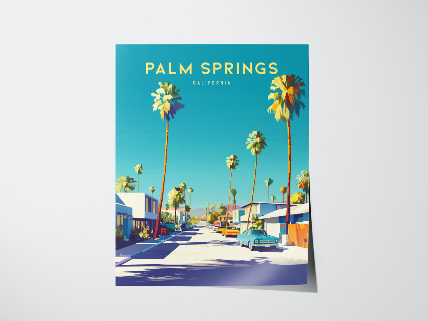 A vibrant poster of Palm Springs, California, features tall palm trees lining a sunlit street with classic cars, against a bright blue sky. Mid-century modern homes are visible.