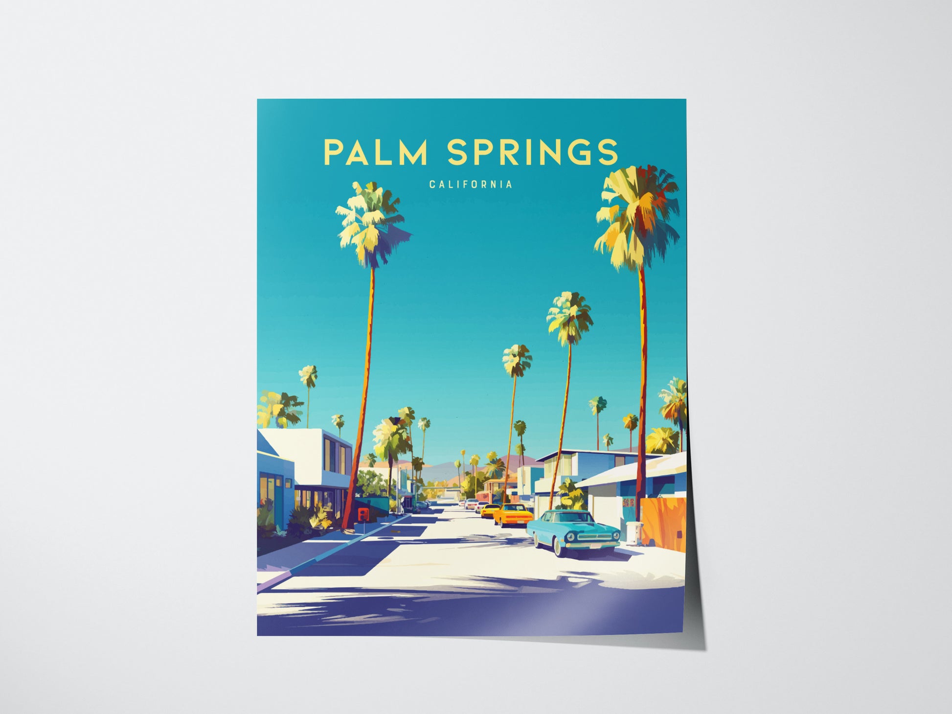 A vibrant poster of Palm Springs, California, features tall palm trees lining a sunlit street with classic cars, against a bright blue sky. Mid-century modern homes are visible.