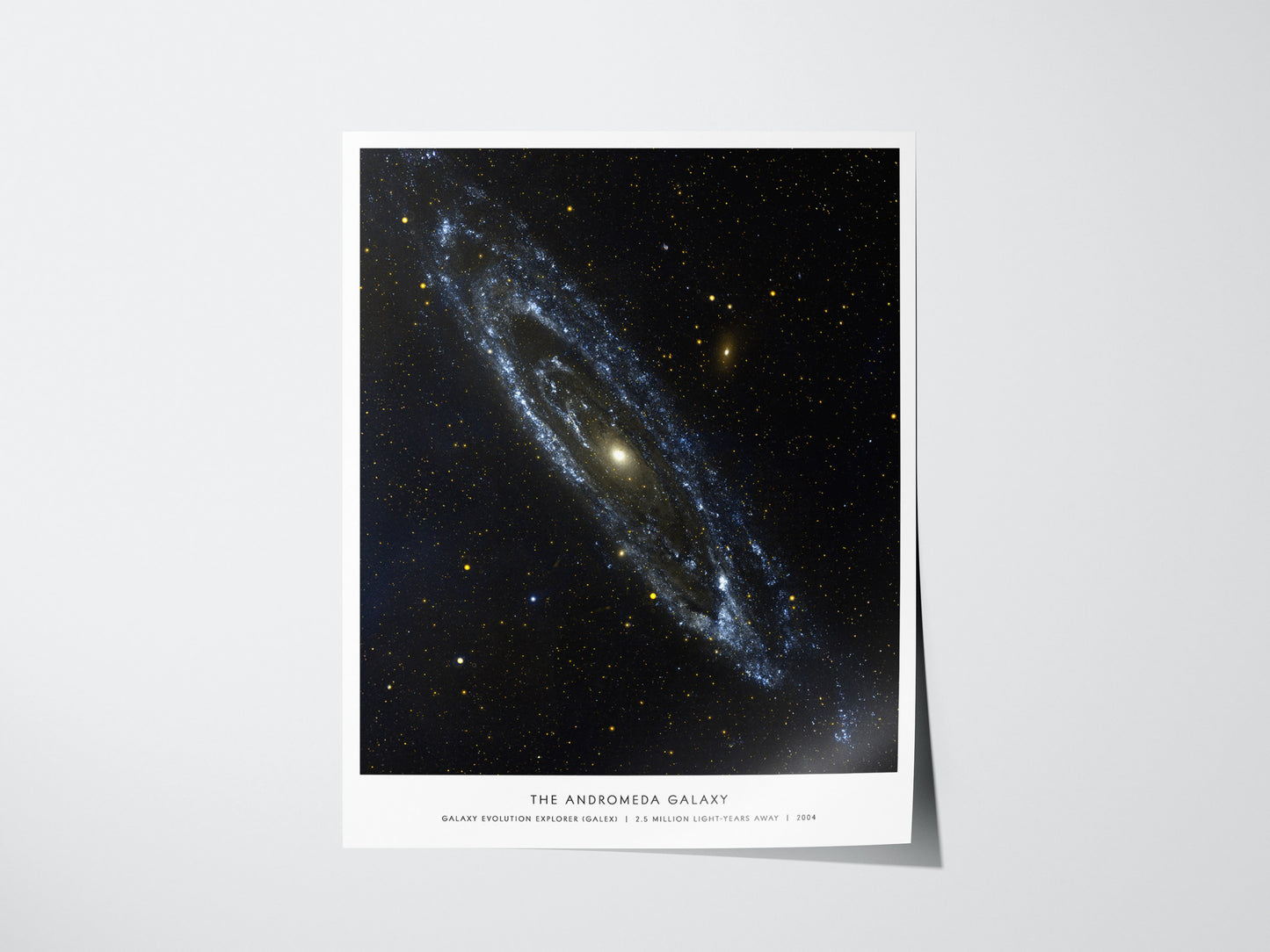 Andromeda Galaxy poster featuring NASA-inspired view of spiral galaxy Messier 31 with bright core and sweeping arms