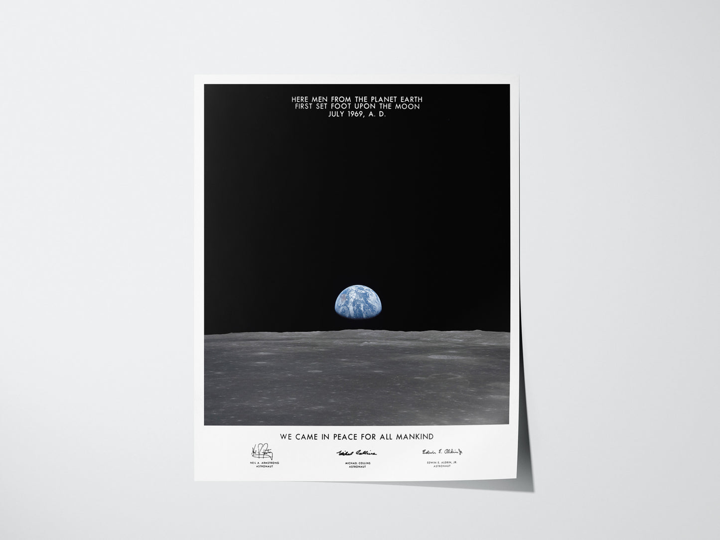 Apollo 11 Earth on the Horizon poster showing Earth rising above the Moon’s surface with plaque text overlay