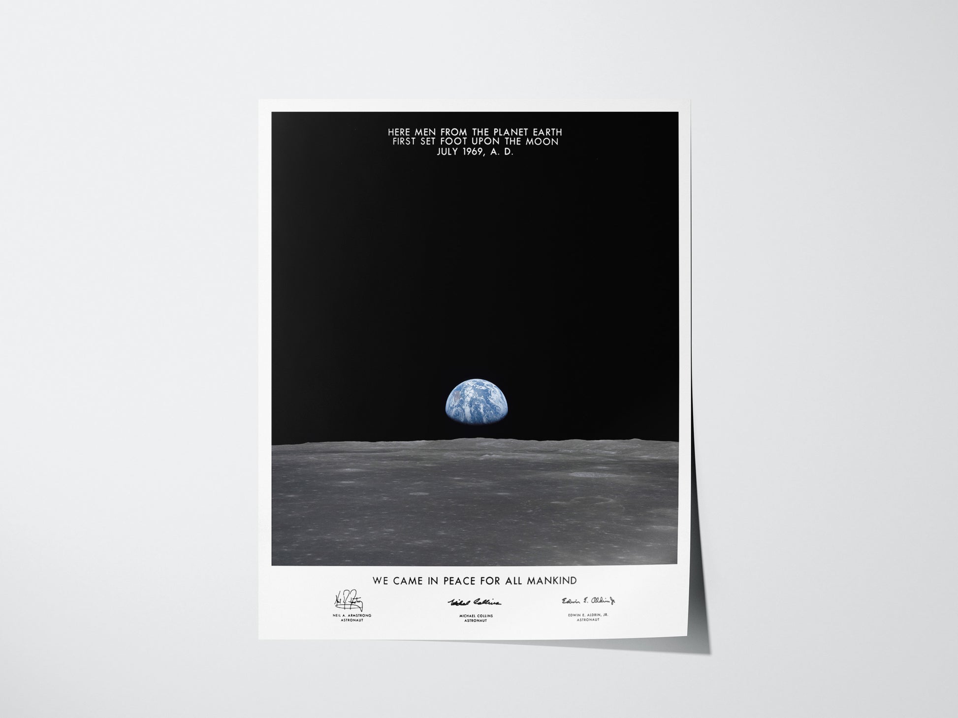 Apollo 11 Earth on the Horizon poster showing Earth rising above the Moon’s surface with plaque text overlay