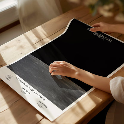 Unframed Apollo 11 Earth on the Horizon NASA poster printed on matte archival paper laid flat on a tabletop