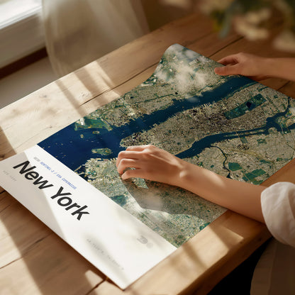 Framed aerial satellite print of New York City, showcasing detailed urban landscape in subdued colors, perfect travel art for decor.