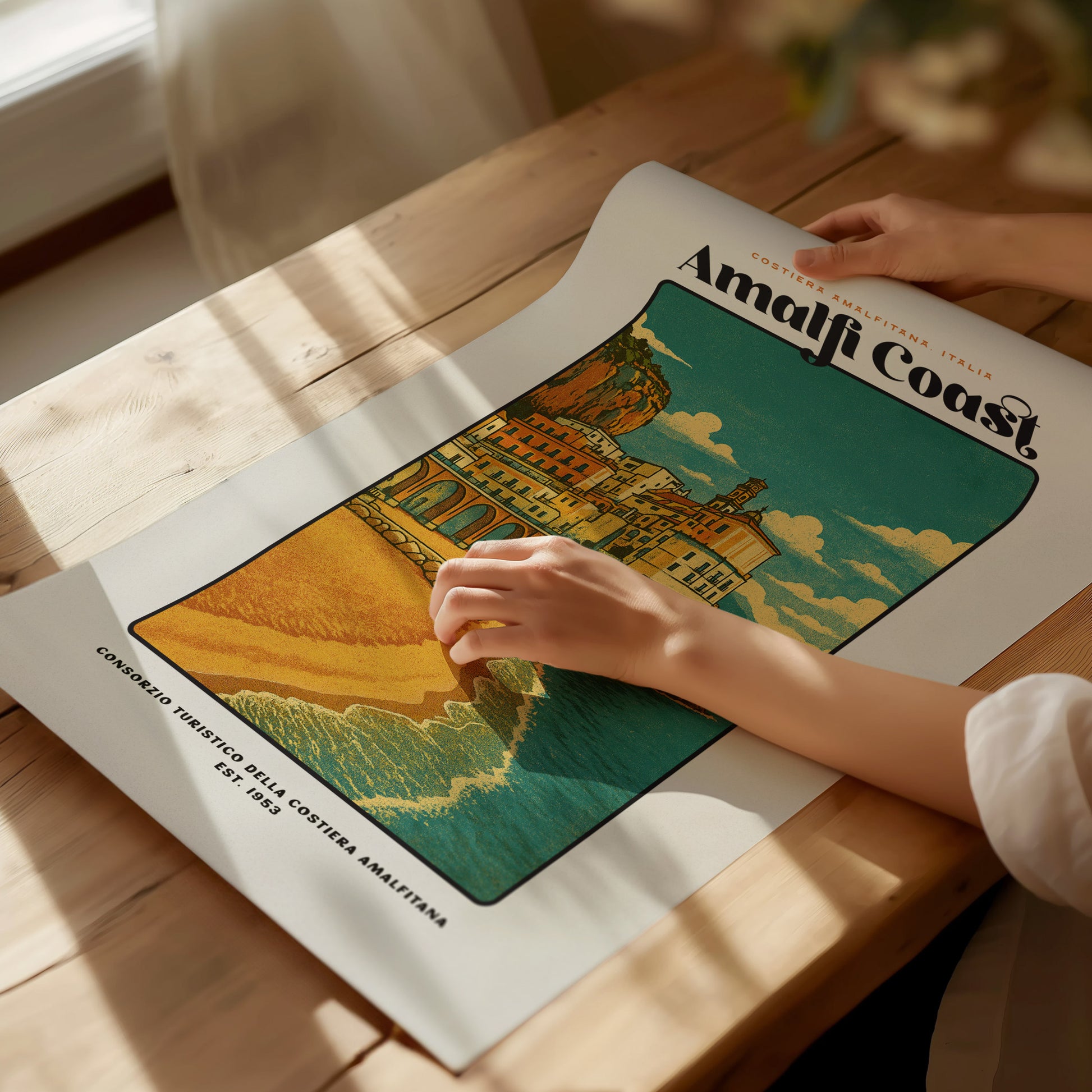 Unframed Amalfi Coast vintage travel print laid flat on a tabletop showing full artwork and typography
