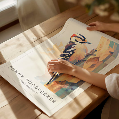 Stylized Downy Woodpecker clinging to a tree trunk in geometric design, featuring warm earth tones and cool accents, perfect for wildlife art lovers.
