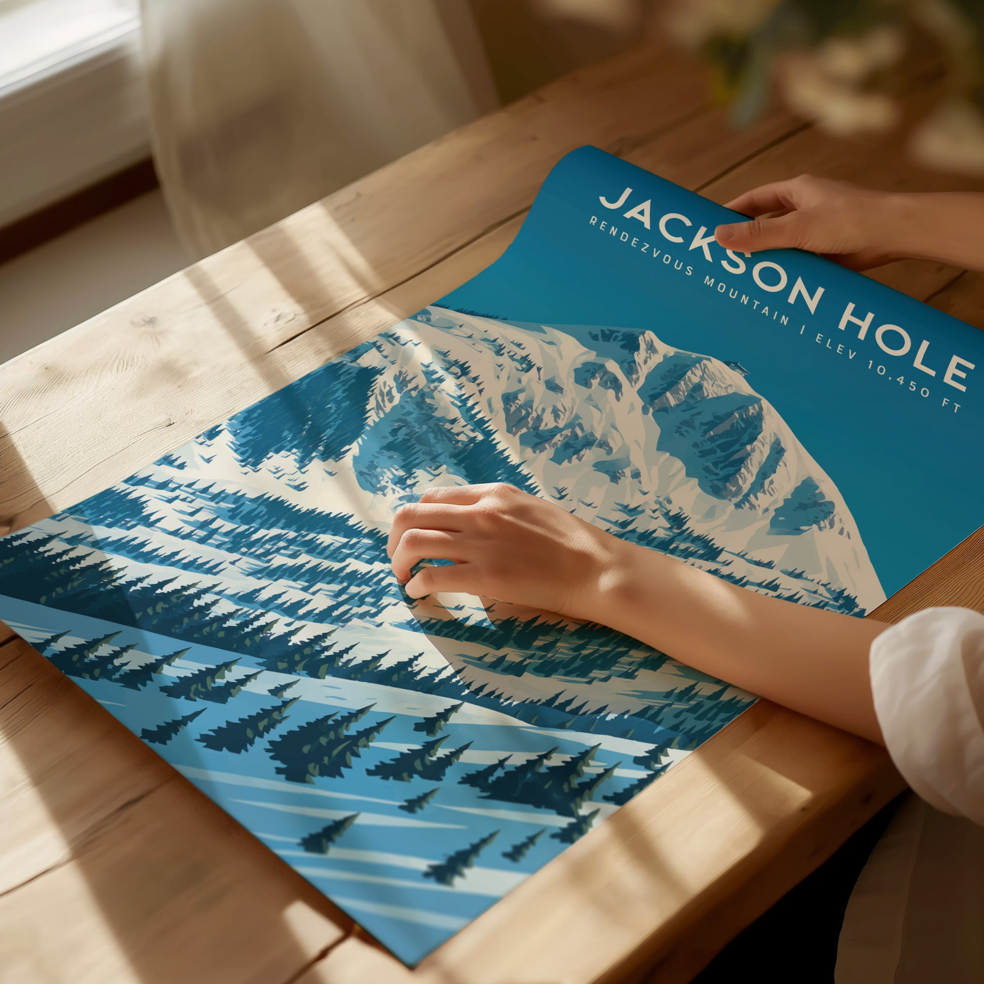 Framed Rendezvous Mountain travel art print showcasing snow-covered peaks in shades of blue, evoking serene winter landscapes.