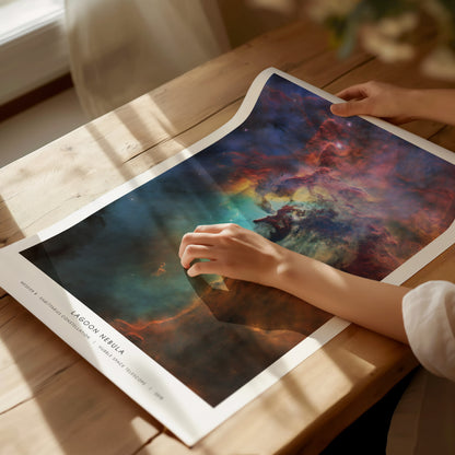 Vibrant Lagoon Nebula in deep blues, fiery reds, and ethereal purples, framed NASA wall art showcasing the Sagittarius constellation.