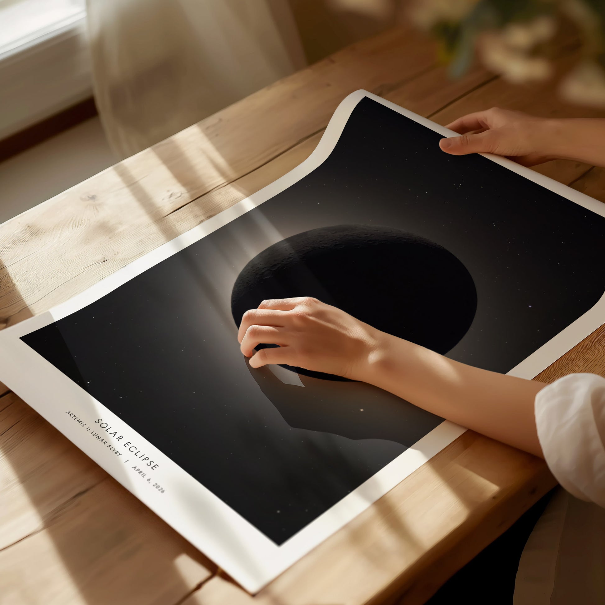 Framed solar eclipse wall art featuring the moon partially covering the sun, with a glowing halo effect and starry background, by Swell Scenes.