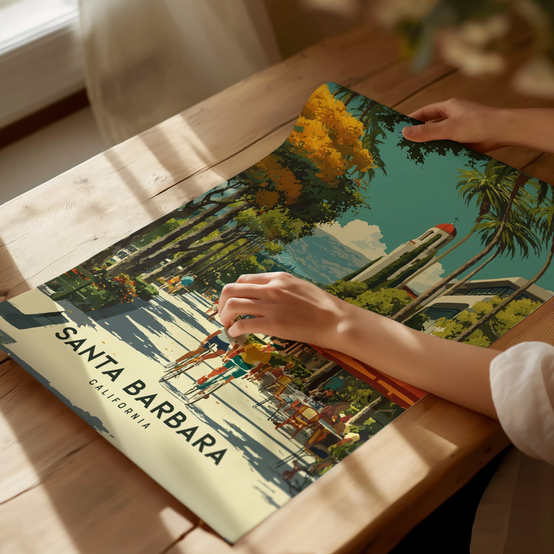 Santa Barbara California poster used as decor above a modern sofa with neutral coastal accents