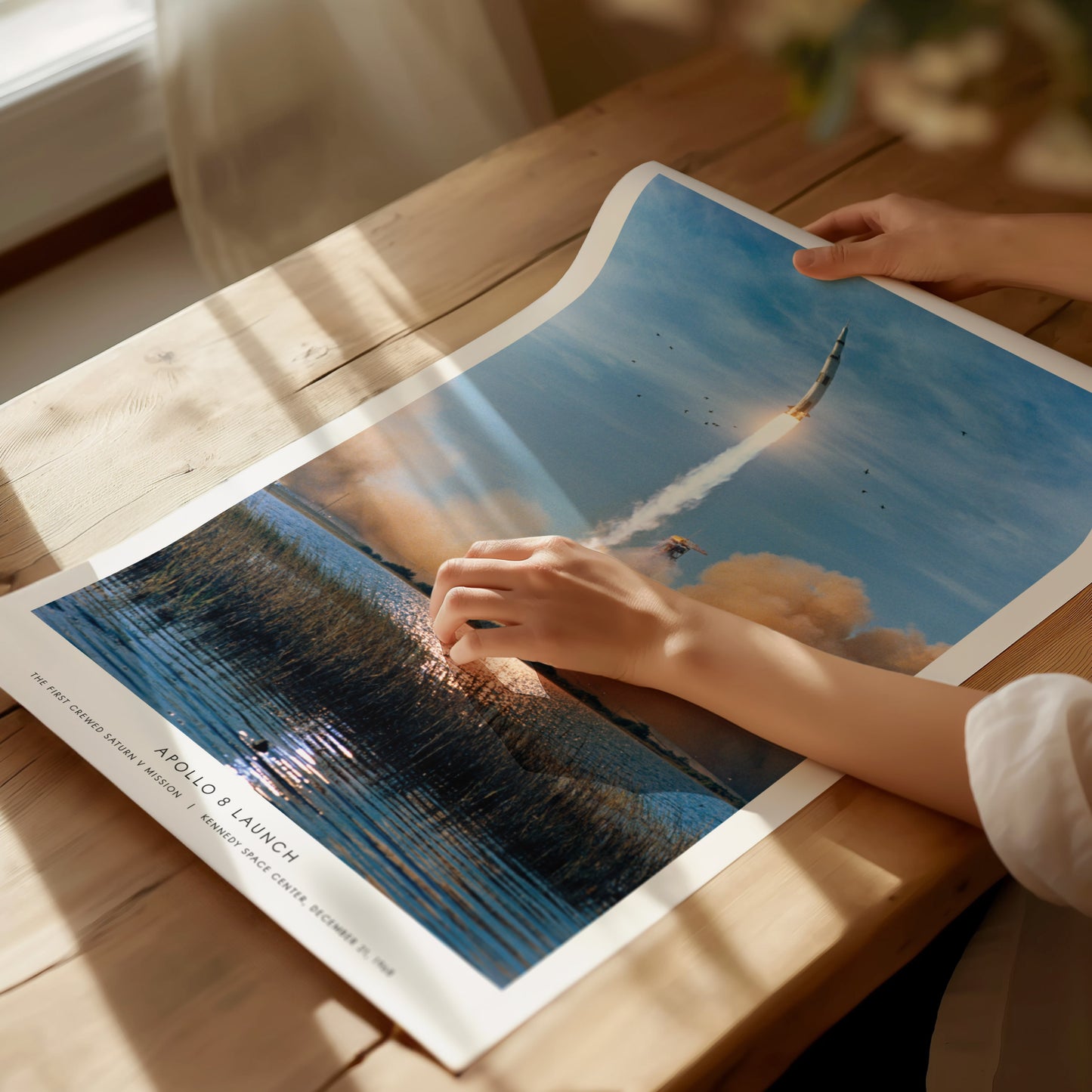 Unframed Apollo 8 launch NASA art print on matte archival paper laid flat on a table