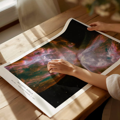 Framed Butterfly Nebula poster (NGC 6302) features vibrant purple, pink, and blue hues; stunning Hubble Space Telescope wall art for space exploration lovers.