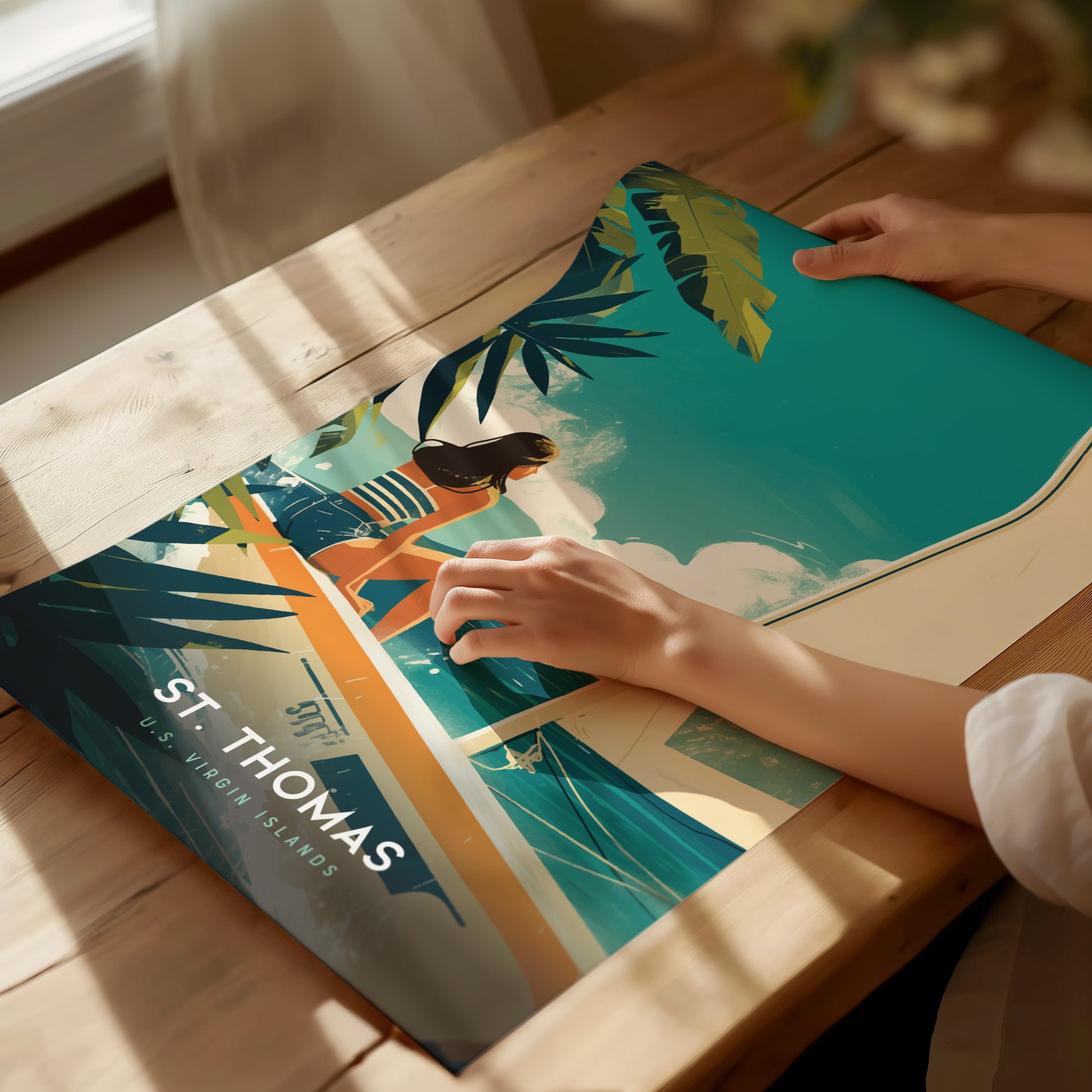 A person handling a colorful poster featuring a woman on a boat in turquoise waters, with palm leaves and St. Thomas U.S. Virgin Islands text.