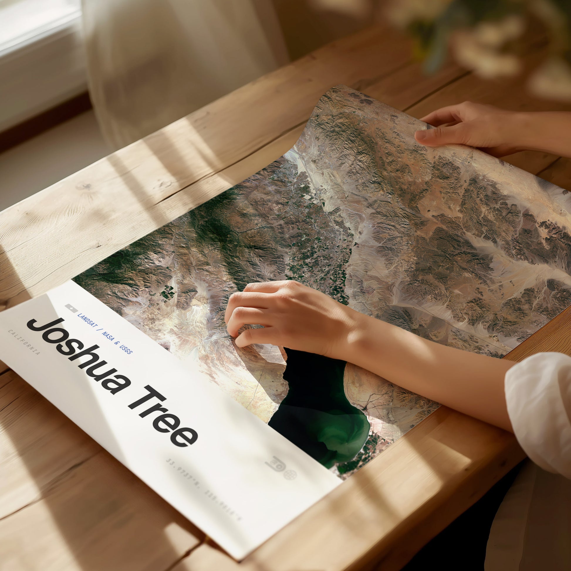 Framed Joshua Tree satellite poster showcasing earthy desert tones, detailed terrain features, and coordinates for travel art enthusiasts.