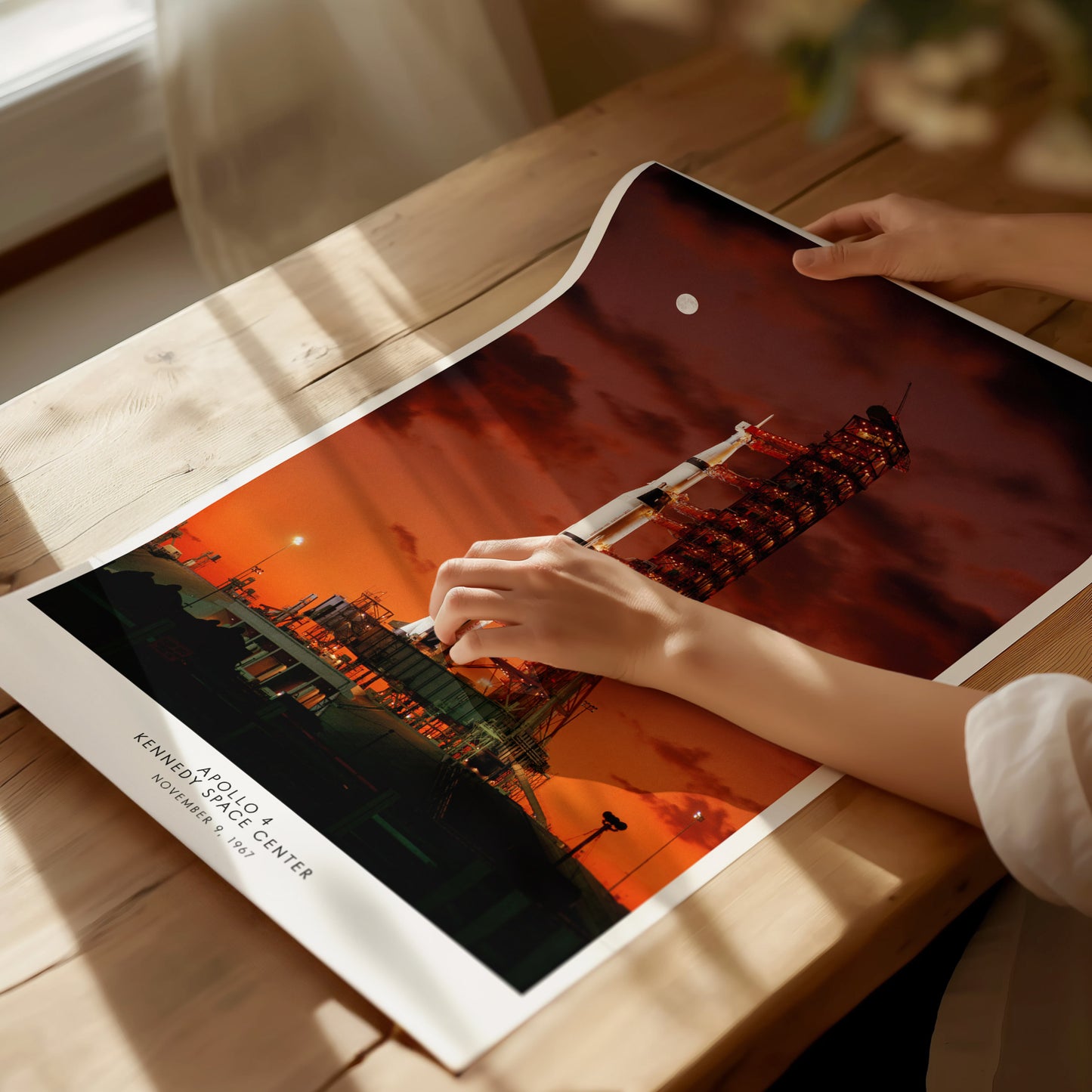 Unframed Apollo 4 launch NASA poster printed on matte archival paper laid flat on a tabletop