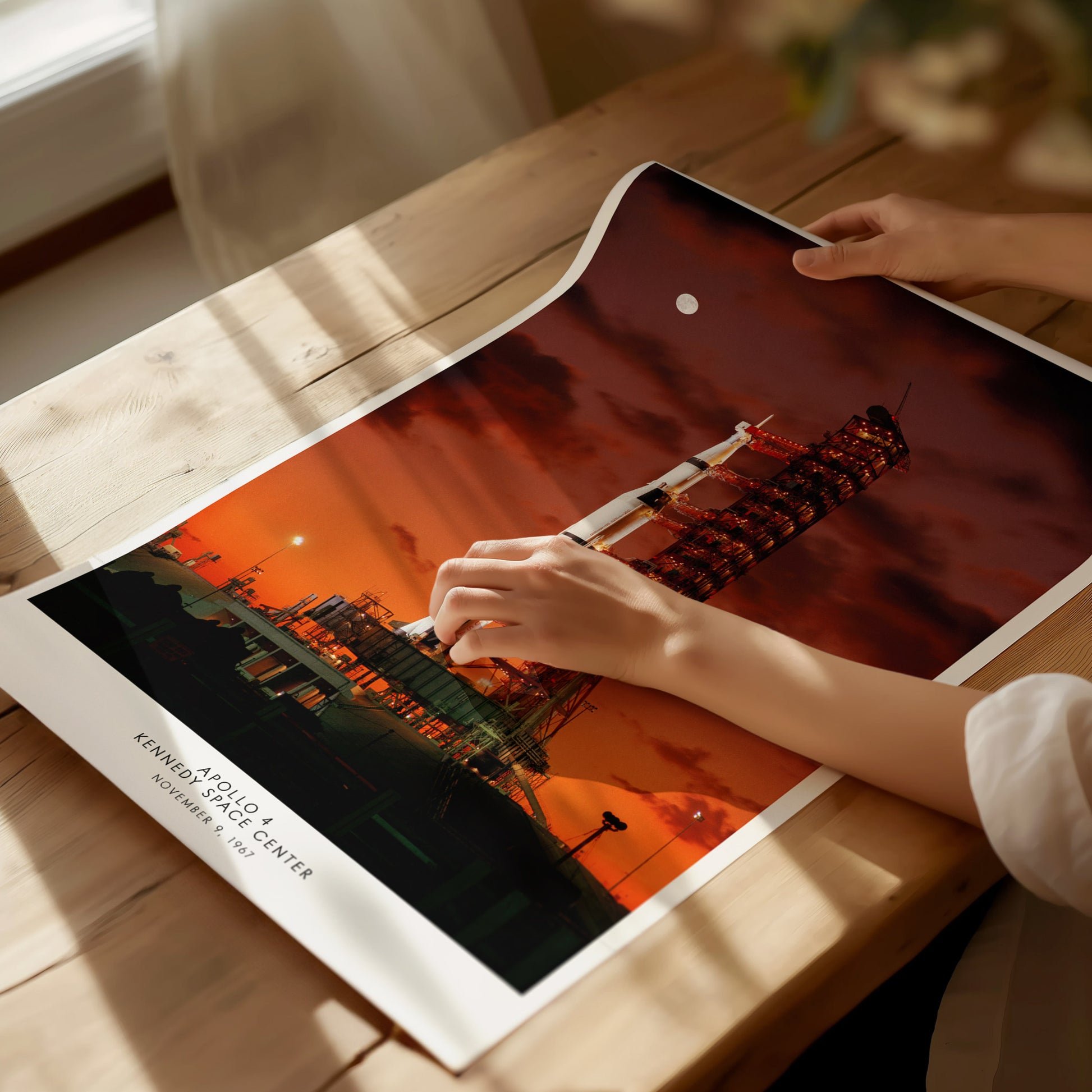 Unframed Apollo 4 launch NASA poster printed on matte archival paper laid flat on a tabletop