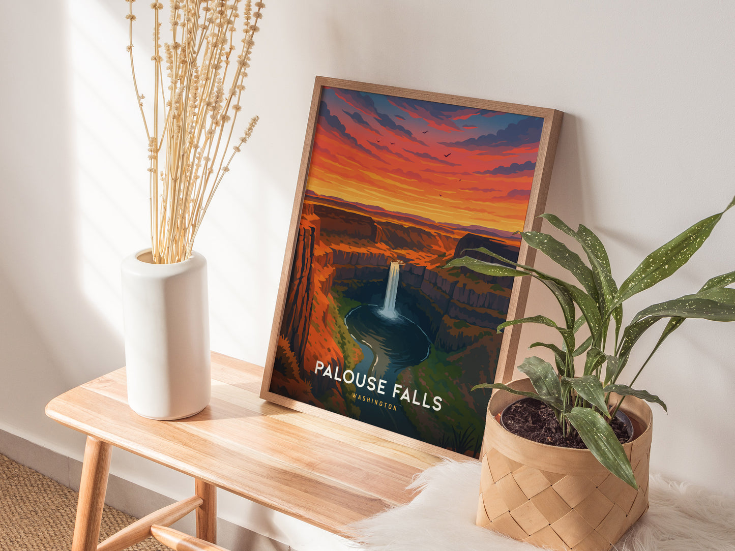 Framed vintage poster of Palouse Falls in Washington, showcasing a sunset with warm hues and dramatic cliffs in travel art style.