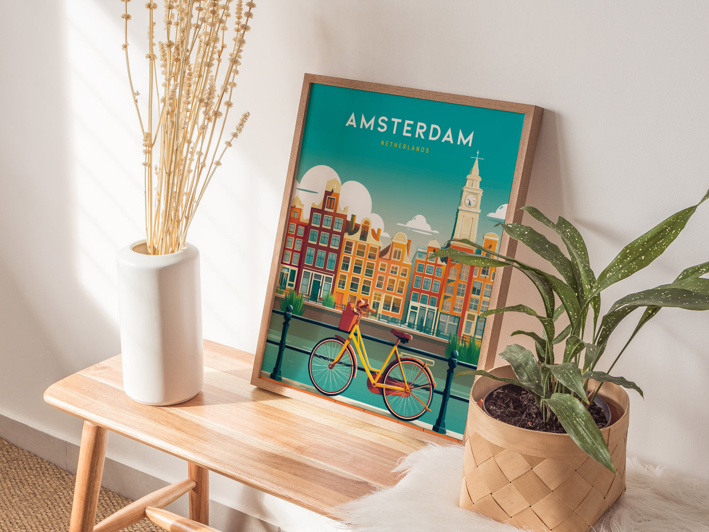 Vibrant Amsterdam wall art poster featuring iconic canal houses and a classic bicycle in vivid teal, orange, and yellow hues.