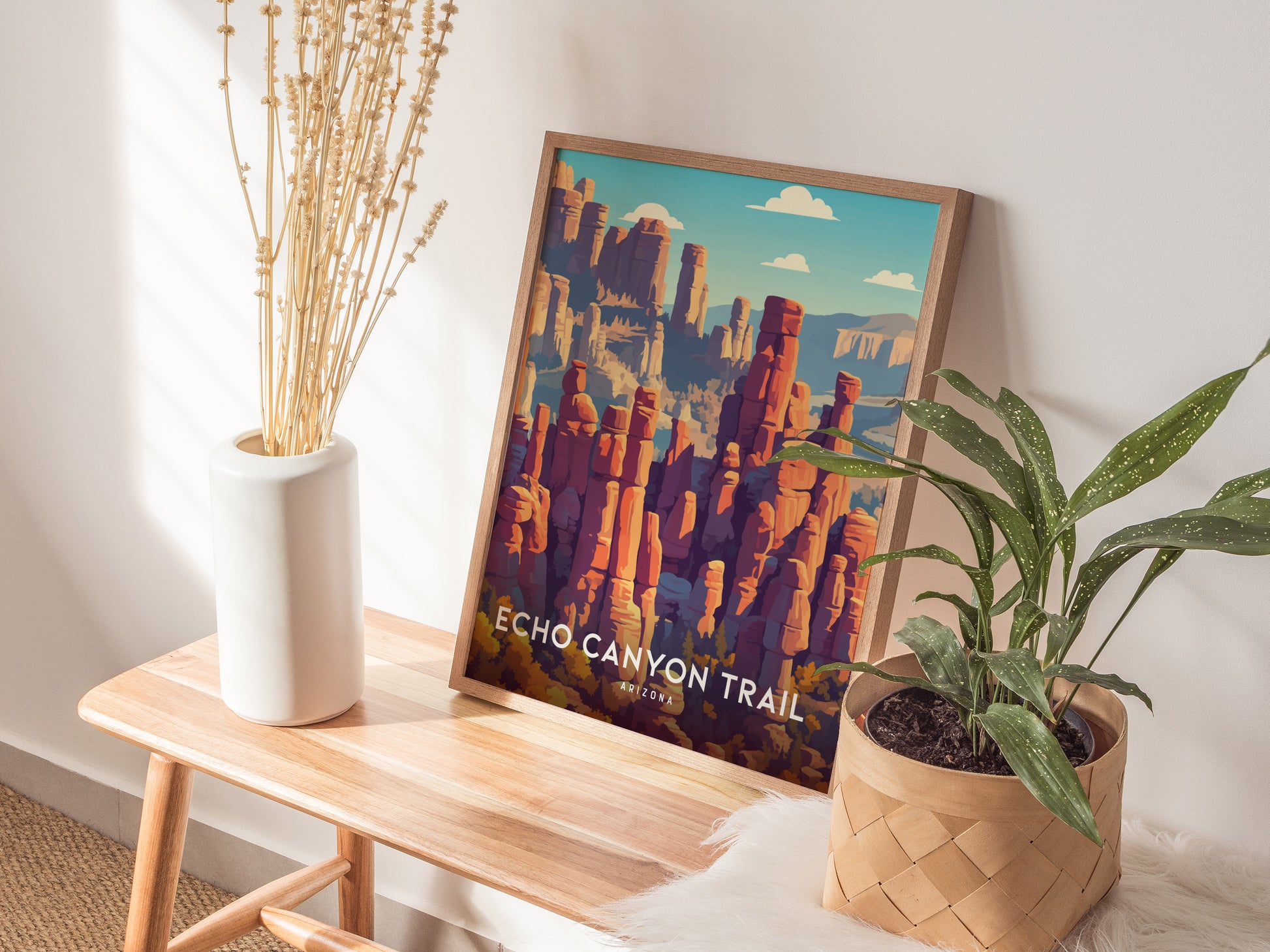 Stylized Echo Canyon Trail wall art features vibrant reds, oranges, and purples of Arizona's rock formations under a blue sky.