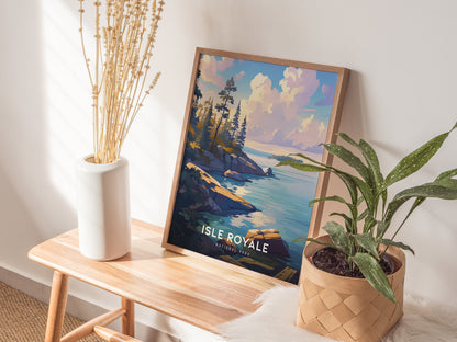 A framed Isle Royale National Park poster featuring a scenic landscape with rocky shorelines and water, leaning against a wall on a wooden bench, accompanied by plants.