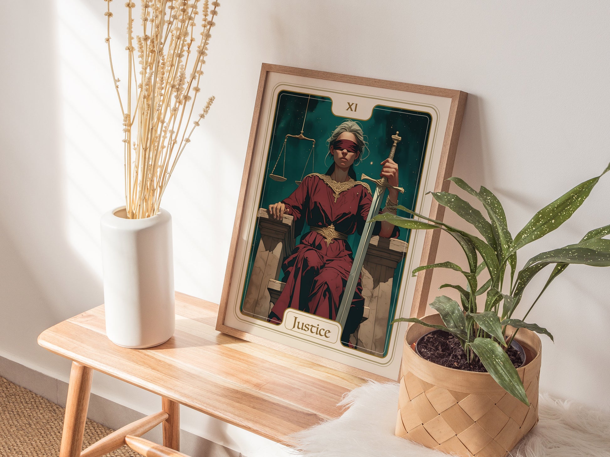 A framed poster of the Justice Tarot card features a seated figure in a flowing red robe, holding a sword and scales, set against a dark green background.