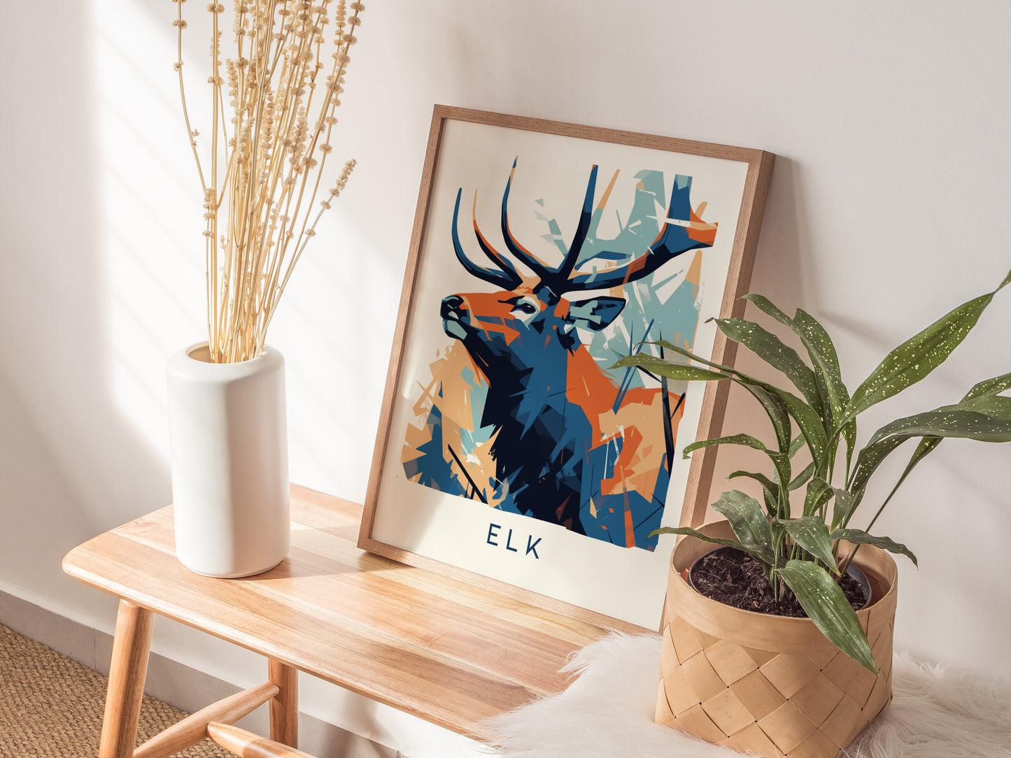 Stylized elk in geometric shapes, featuring bold blue, orange, and teal colors; modern wildlife abstract print for nature lovers.