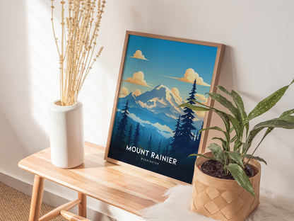 A framed Mount Rainier poster leans against a wall on a wooden bench, with a plant in a woven basket and a vase of dried flowers nearby.