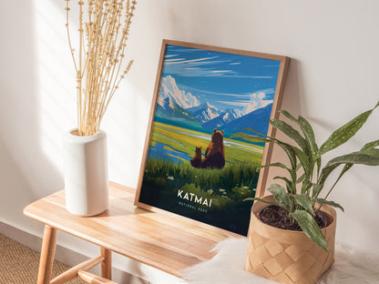 A framed Katmai National Park poster featuring bears in a scenic landscape is displayed on a wooden table, accompanied by a white vase with dried stems and a potted plant.